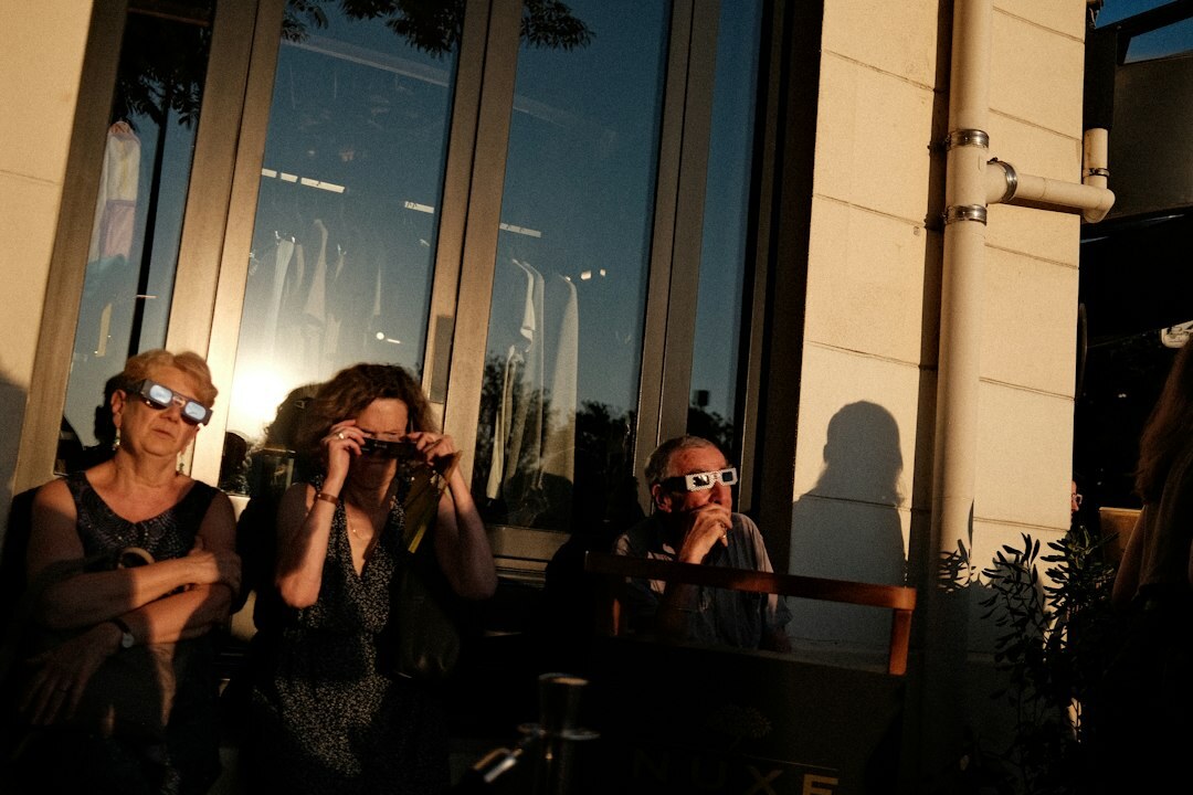 Photographers with cameras and flashes at a press event