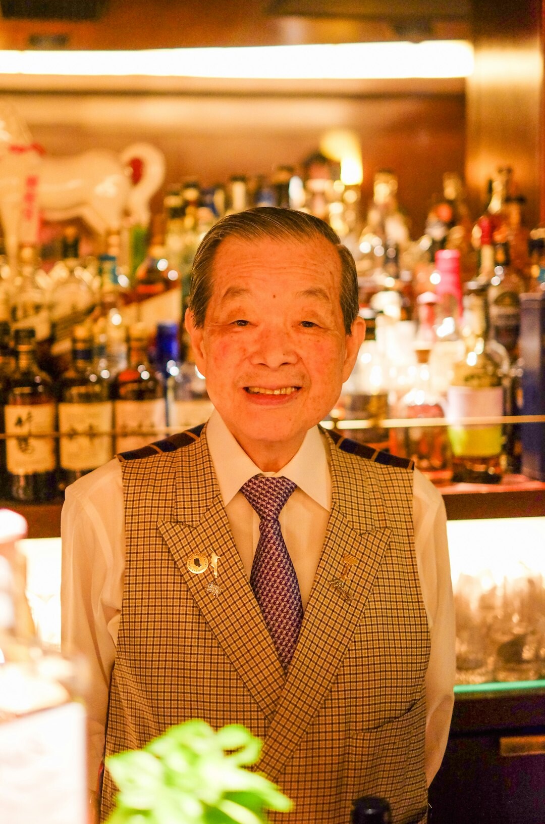 Portrait of a Japanese man in his 50s in a suit, editor in chief